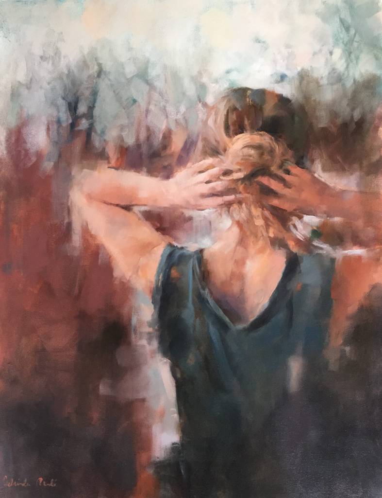 Woman with hands in hair