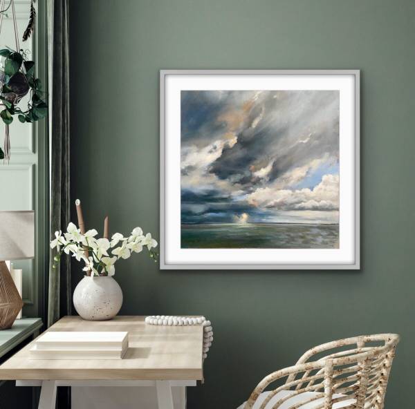 Framed painting of dramatic clouds